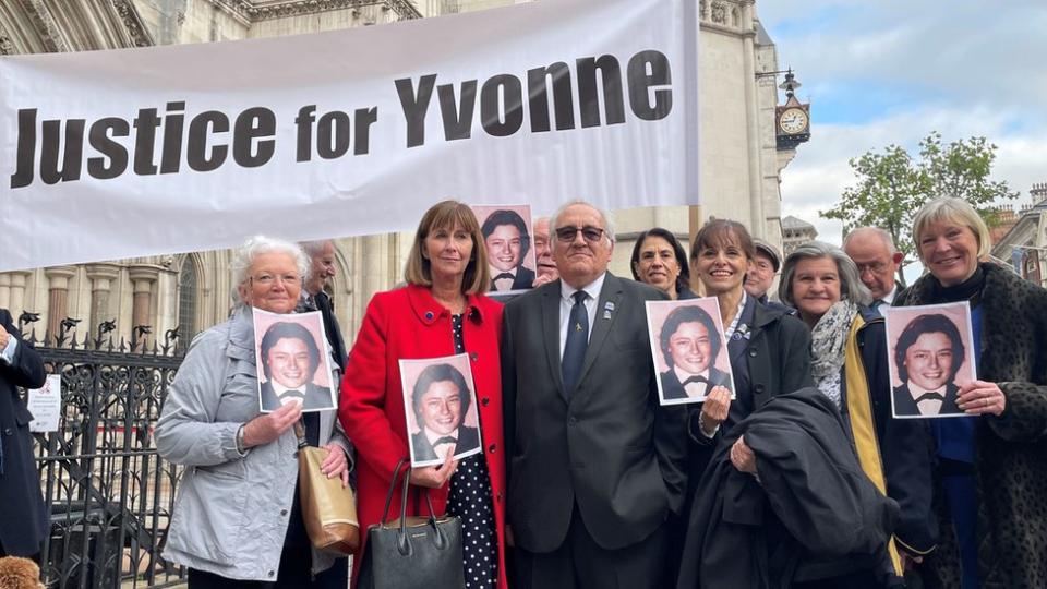 Retired police officer John Murray (centre) outside the Royal Courts of Justice in London, after he won his High Court bid