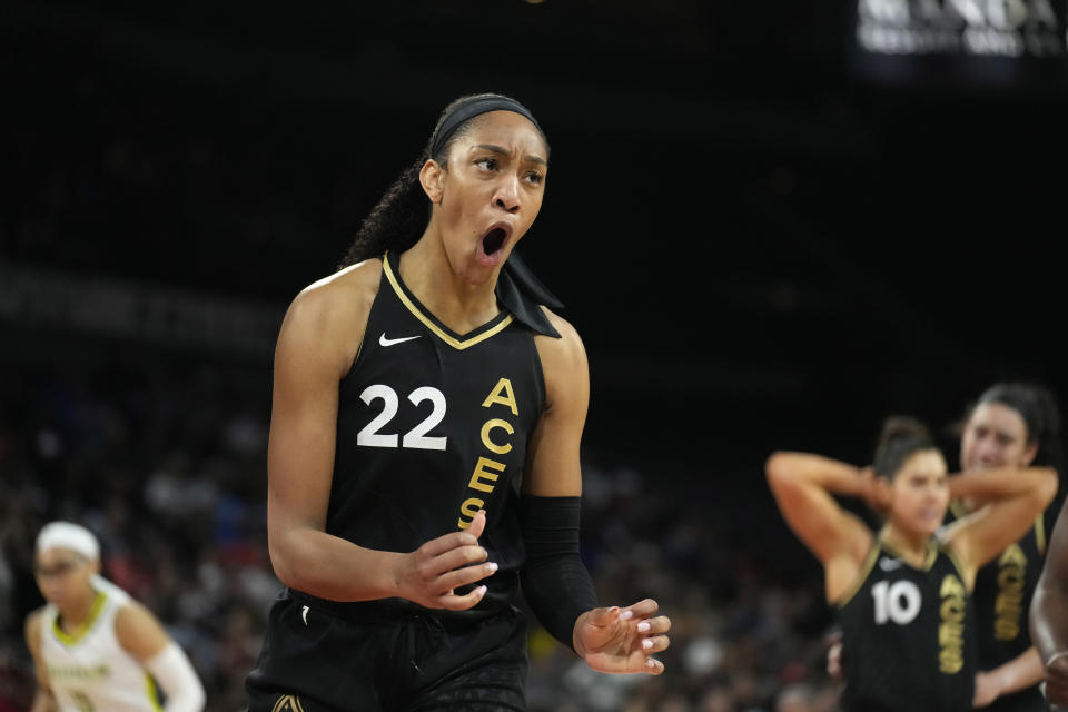 Las Vegas Aces' A'ja Wilson (22) reacts after she was called for a foul against the Dallas Wings during the first half of a WNBA basketball game Sunday, June 5, 2022, in Las Vegas. (AP Photo/John Locher)