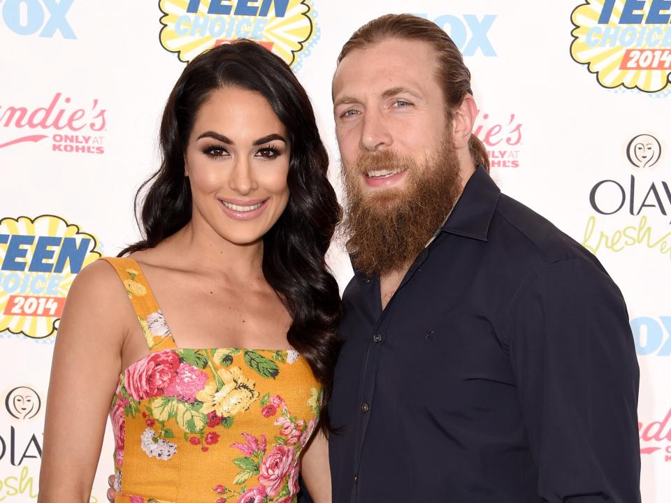 Brie Bella (L) and WWE Superstar Daniel Bryan attend FOX's 2014 Teen Choice Awards at The Shrine Auditorium on August 10, 2014 in Los Angeles, California