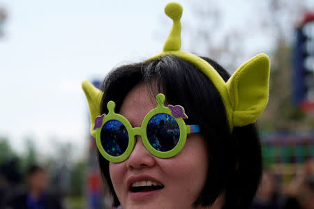 A woman attends the opening event of Disney-Pixar Toy Story Land, the seventh themed land at Shanghai Disneyland, in Shanghai, China April 26, 2018. REUTERS/Aly Song