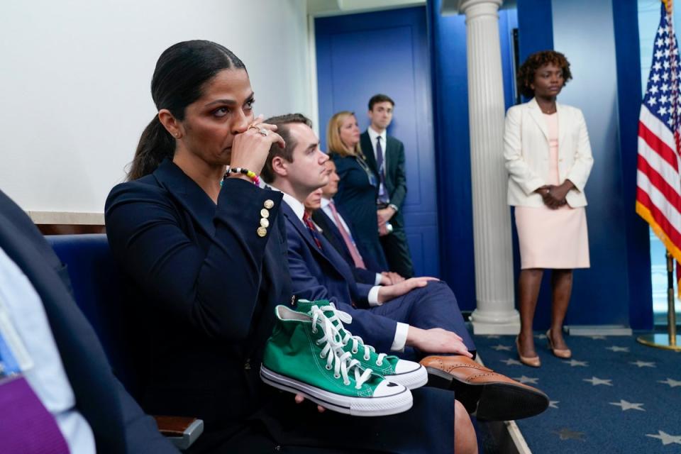 Camila Alves McConaughey holds the lime green Converse tennis shoes that were worn by Uvalde shooting victim Maite Yuleana Rodriguez, 10 (AP)