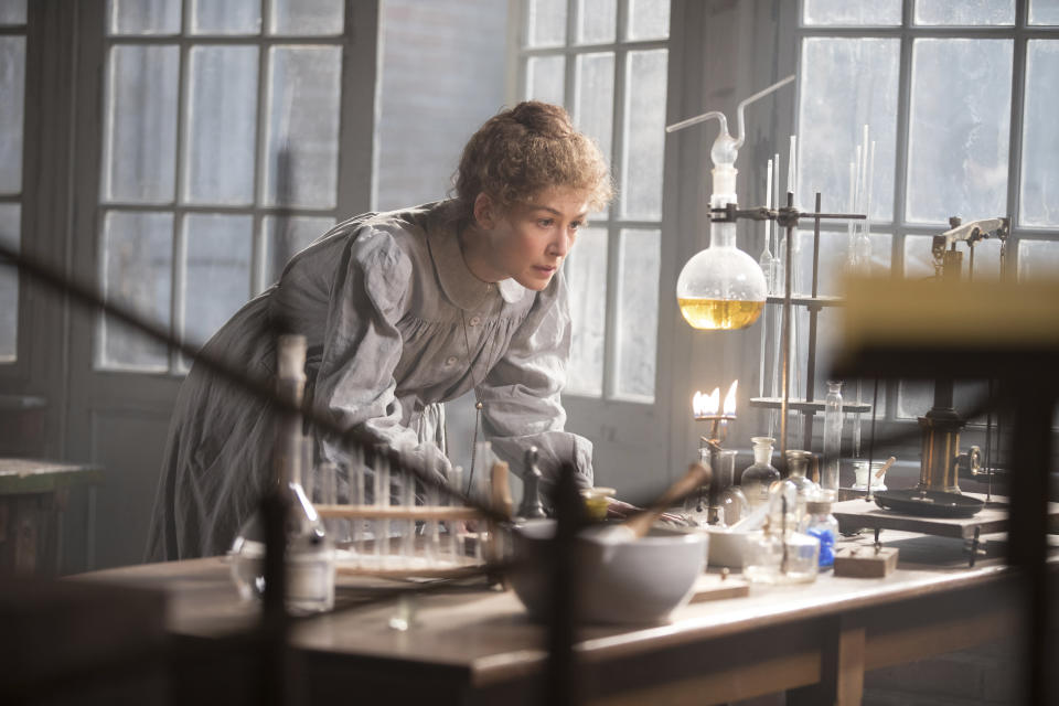 This image released by Amazon shows Rosamund Pike as Marie Curie in a scene from "Radioactive." (Amazon via AP)