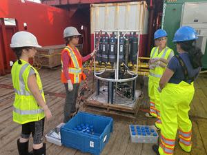 L to R: Connor Mackie (Dartmouth Ocean Technologies), Lina Garcia, Claire Normandeau and Natasha Rondon (all Dalhousie University) review the sea water sampling strategy from the rosette that measures conductivity, temperature and depth (CTD).Photo credit – Dr. Dariia Atamanchuk