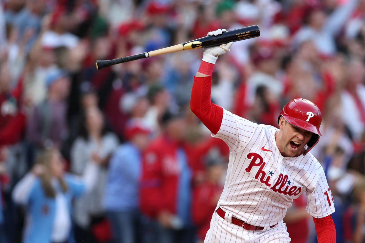 Philadelphia Phillies' Rhys Hoskins spikes his bat after hitting a two-run home run against the Atlanta Braves during Game 3 of the National League Division Series at Citizens Bank Park on October 14, 2022 in Philadelphia. (Photo by Patrick Smith/Getty Images)