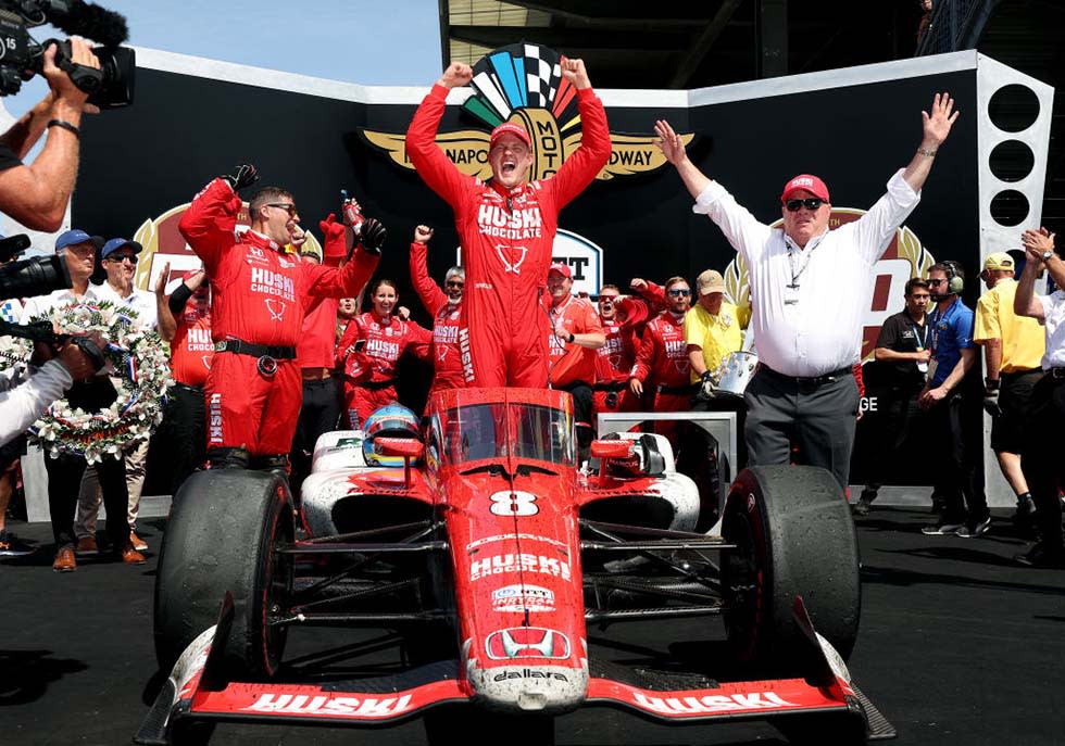  Marcus Ericsson of Sweden, driver of the #5 Chip Ganassi Racing Honda, celebrates as he gets out of his car in Victory Lane after winning the 106th Running of The Indianapolis 500 at Indianapolis Motor Speedway on May 29, 2022  
