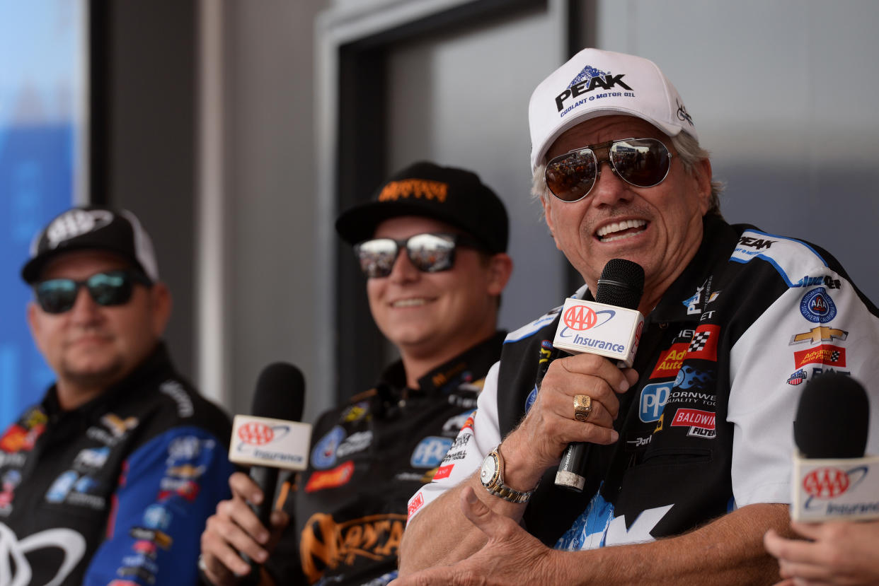 MADISON, IL - SEPTEMBER 28: John Force (9 FC) JFR Chevrolet Camaro SS NHRA Funny Car talks with fans on the AAA Stage in the midway area during qualifying for the NHRA Mellow Yellow Drag Racing Series AAA Midwest Nationals on September 28, 2019, at World Wide Technology Raceway in Madison, Illinois. (Photo by Michael Allio/Icon Sportswire via Getty Images)