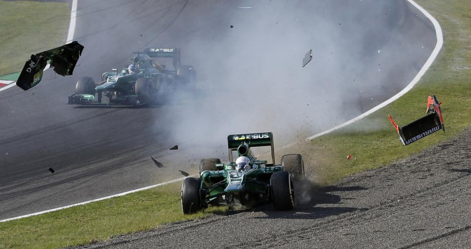 Caterham Formula One driver Giedo van der Garde of Netherlands crashes after colliding with Marussia Formula One driver Jules Bianchi of France during the Japanese F1 Grand Prix at the Suzuka circuit October 13, 2013. REUTERS/Issei Kato (JAPAN - Tags: SPORT MOTORSPORT F1 TPX IMAGES OF THE DAY)