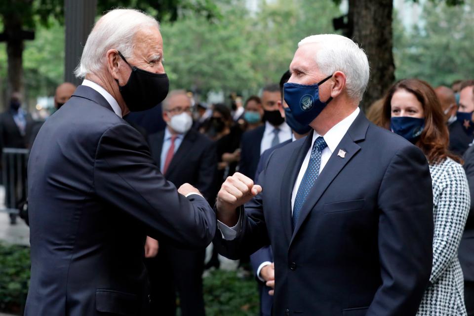 Joe Biden greets Vice President Mike Pence at the 19th anniversary ceremony marking the 9/11 attacks at the National September 11 Memorial & Museum in New York on Sept. 11, 2020.