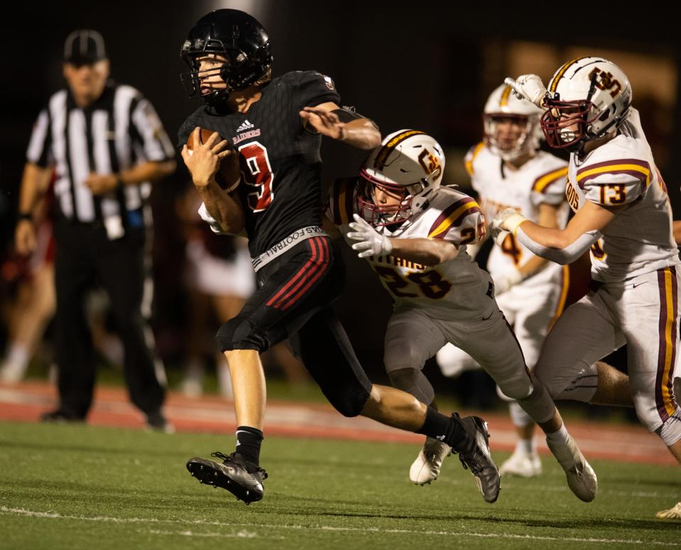 Southridge's Carter Harris (9) is tackled by Gibson Southern’s Zach Foster (28) as the Southridge Raiders play the Gibson Southern Titans at Southridge High School in Huntingburg, Ind., Friday evening, Sept. 16, 2022. 