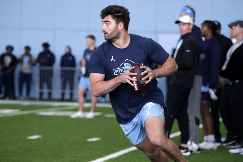 North Carolina quarterback Sam Howell demonstates his skills for NFL scouts during Pro Day, Monday, March 28, 2022, in Chapel Hill, N.C. (AP Photo/Chris Seward)