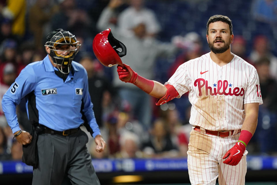 Philadelphia Phillies' Kyle Schwarber reacts after striking out against Milwaukee Brewers pitcher Eric Lauer during the sixth inning of a baseball game, Sunday, April 24, 2022, in Philadelphia. (AP Photo/Matt Slocum)