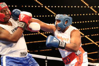 <p>Kenneth Haynes, right, stretches his reach to connect against Laron Rhodie during the NYPD Boxing Championships at the Theater at Madison Square Garden on June 8, 2017. (Photo: Gordon Donovan/Yahoo News) </p>