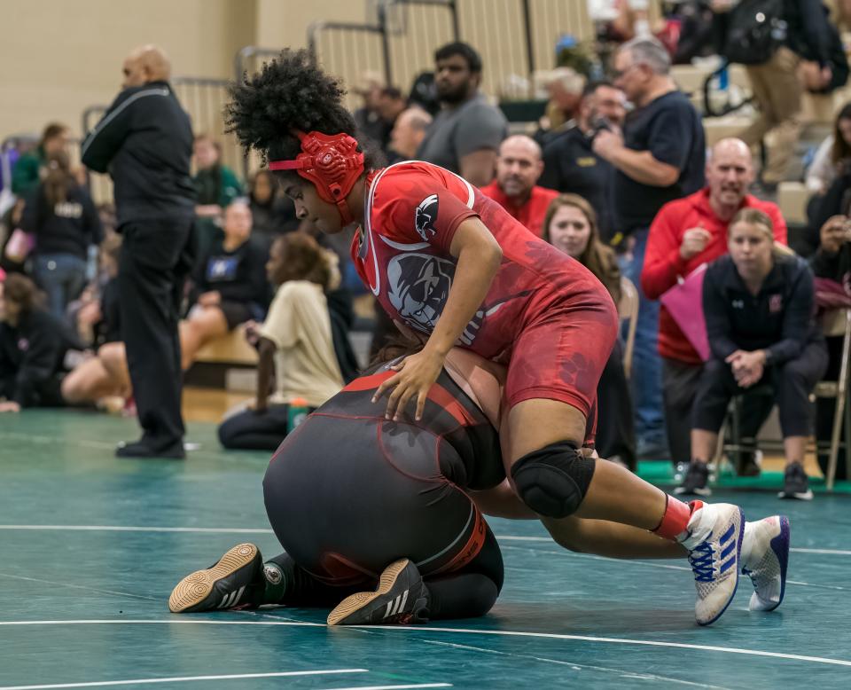 Kingsway's Brea Heil (red/white) beats Perth Amboy's Shalyse Fairman (black/red) in the 235 weight class semi-finals at the 2022 East Brunswick Lady Bear Invitational Tournament on Dec. 30 at the Churchill Junior High School gymnasium in East Brunswick.
