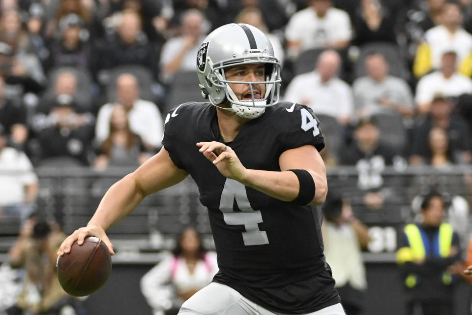 Las Vegas Raiders quarterback Derek Carr scrambles during the first half of an NFL football game against the Houston Texans, Sunday, Oct. 23, 2022, in Las Vegas. (AP Photo/David Becker)