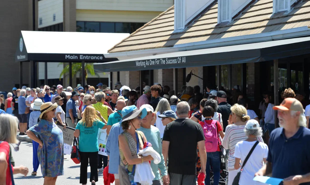 On April 4, a long line forms to enter a Sarasota County School Board meeting following a protest of the board's proposal to hire Vermilion Education, a consulting firm.