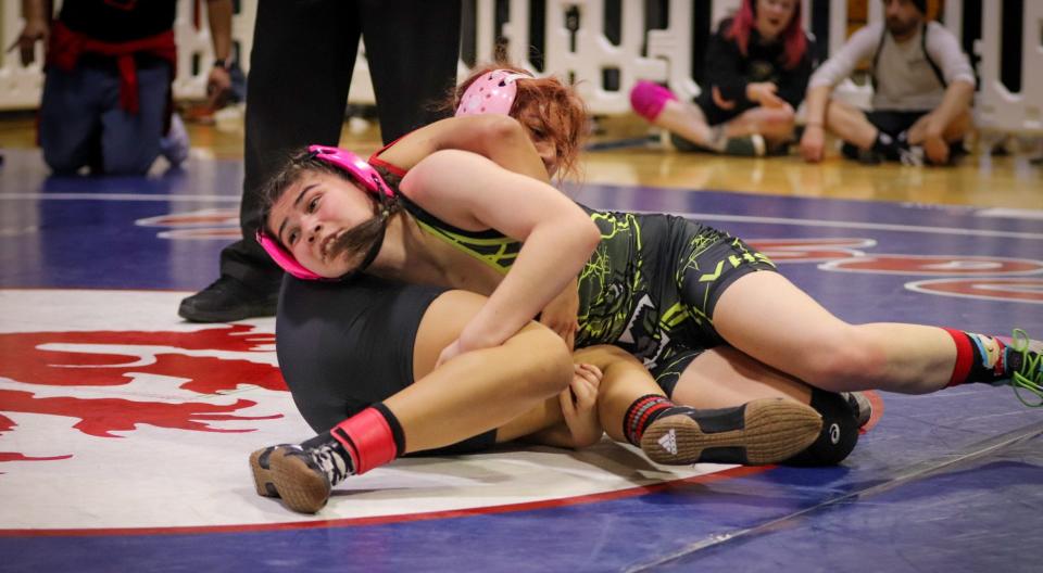 Ventura's Hailey Padilla tries to keep Rio Mesa's Alicia Flores pinned down during the Channel League wrestling championships on Saturday at San Marcos High. Padilla won the 127-pound title.