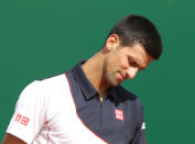 Novak Djokovic of Serbia reacts after losing a point against Roger Federer of Switzerland, during their semifinal match of the Monte Carlo Tennis Masters tournament, in Monaco, Saturday, April, 19, 2014. Federer won 7-6, 6-2. (AP Photo/Claude Paris)