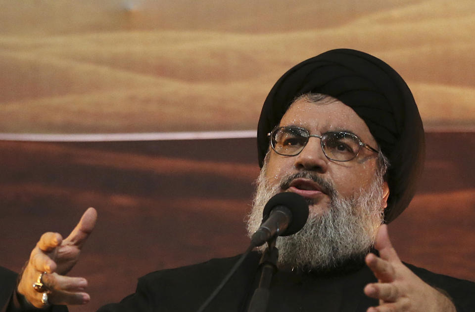 FILE -In this Nov. 3, 2014 file photo, Hezbollah leader Sheik Hassan Nasrallah addresses supporters ahead of the Shiite Ashura commemorations, in the southern suburb of Beirut, Lebanon. On Saturday, Jan. 26, 2019, the head of Lebanon's Hezbollah group is warning Israel of widening its attacks in Syria because a miscalculation can drag the region into a war. (AP Photo/Hussein Malla, File)