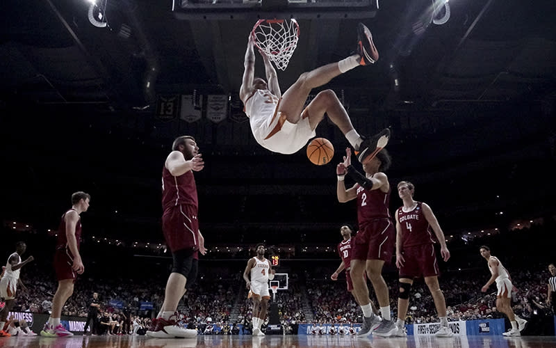 Texas's Christian Bishop dunks during the second half of a first-round college basketball game