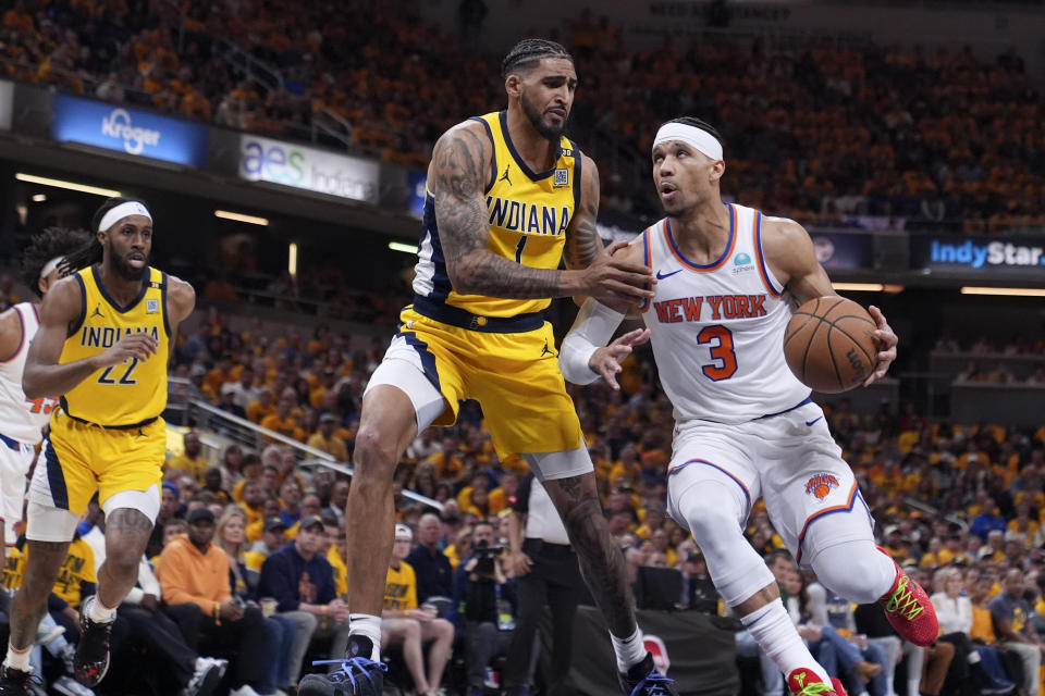 New York Knicks guard Josh Hart (3) drives to the basket past Indiana Pacers forward Obi Toppin (1) during the first half of Game 3 in an NBA basketball second-round playoff series, Friday, May 10, 2024, in Indianapolis. (AP Photo/Michael Conroy)