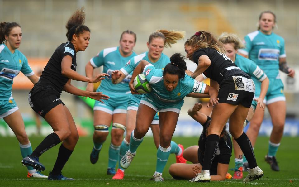 Jade Shekells of Worcester Warriors looks to break past Lottie Holland of Exeter Chiefs during the Allianz Premier 15s match between Exeter Chiefs Women and Worcester Warriors - Harry Trump/Getty Images