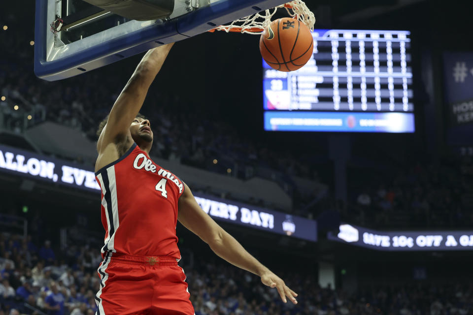 Mississippi's Jaemyn Brakefield (4) dunks during the second half of an NCAA college basketball game against Kentucky Tuesday, Feb. 13, 2024, in Lexington, Ky. Kentucky won 75-63. (AP Photo/James Crisp)