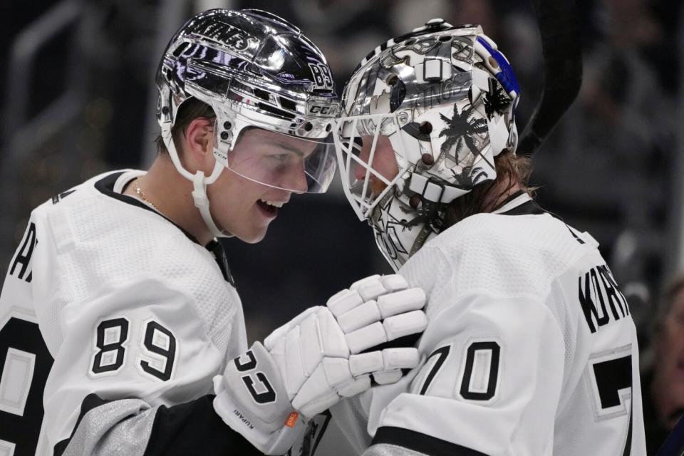 Rasmus Kupari, left, and Joonas Korpisalo celebrate a Kings victory over the Winnipeg Jets on March 25, 2023.