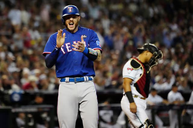 <p>Mary DeCicco/MLB Photos via Getty</p> Jonah Heim (left)