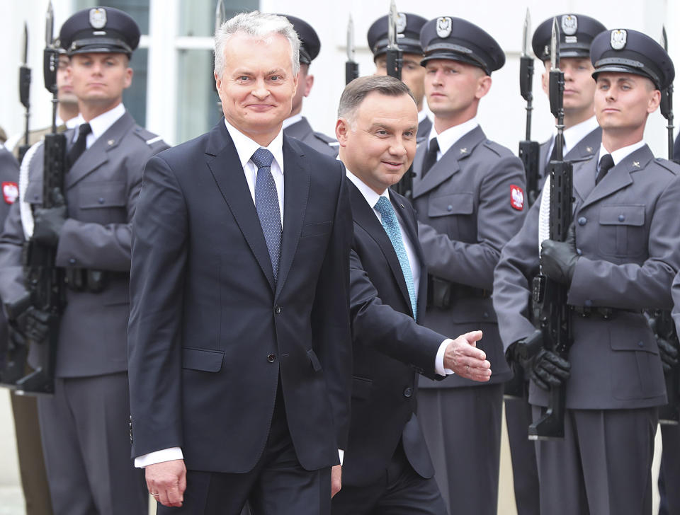 CAPTION CORRECTS THE NAME - Polish President Andrzej Duda, right, and Lithuanian President Gitanas Nauseda, left, arrive for a military welcome ceremony at the presidential Palace in Warsaw, Poland, Tuesday, July 16, 2019.(AP Photo/Czarek Sokolowski)