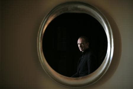 British actor Ralph Fiennes poses for a portrait in Beverly Hills, California, December 4, 2013. REUTERS/Lucy Nicholson