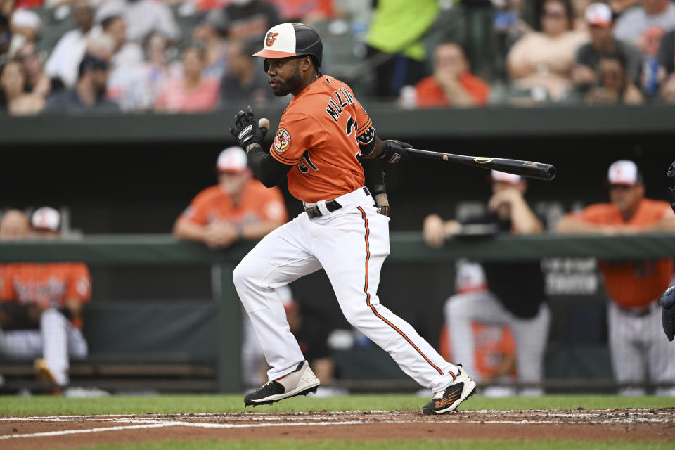 Baltimore Orioles' Cedric Mullins follows through on a single against the New York Yankees during the first inning of a baseball game Saturday, July 23, 2022, in Baltimore.(AP Photo/Gail Burton)