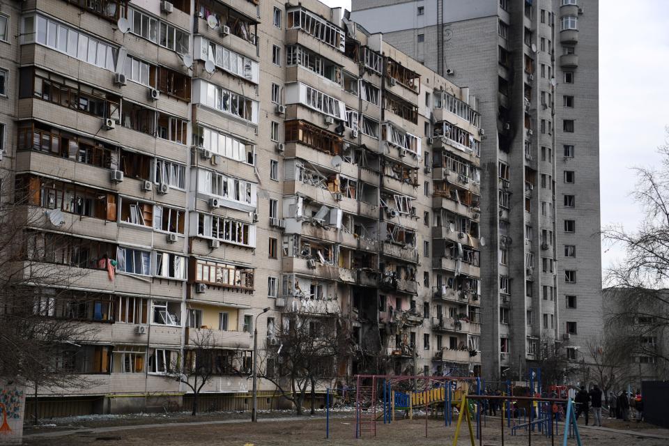 A general view of a damaged residential building at Koshytsa Street, a suburb of the Ukrainian capital Kyiv, where a military shell allegedly hit, on February 25, 2022. Russian forces reached the outskirts of Kyiv on Friday as Ukrainian President Volodymyr Zelensky said the invading troops were targeting civilians and explosions could be heard in the besieged capital. Pre-dawn blasts in Kyiv set off a second day of violence after Russian President Vladimir Putin defied Western warnings to unleash a full-scale ground invasion and air assault on Thursday that quickly claimed dozens of lives and displaced at least 100,000 people.
 / AFP / Daniel LEAL