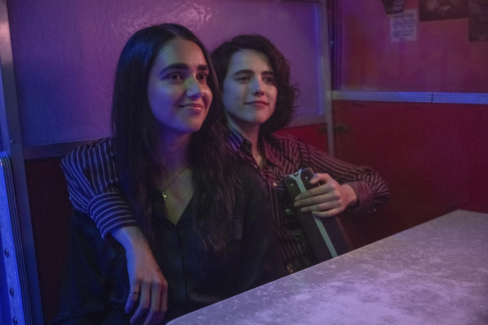 This image released by Focus Features shows Geraldine Viswanathan, left, and Margaret Qualley in a scene from "Drive-Away Girls." (Wilson Webb/Focus Features via AP)