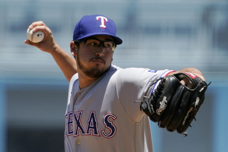 Texas Rangers starting pitcher Dane Dunning throws to the plate during the first inning of a baseball game against the Los Angeles Dodgers Sunday, June 13, 2021, in Los Angeles. (AP Photo/Mark J. Terrill)