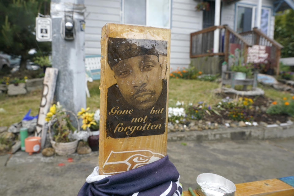 FILE - A sign is displayed on May 27, 2021, at a memorial in Tacoma, Wash., where Manuel "Manny" Ellis died March 3, 2020, after he was restrained by police officers. Opening statements are expected to begin as early as Tuesday, Oct. 3, 2023, in the trial of the three officers charged with Ellis' death. (AP Photo/Ted S. Warren, File)