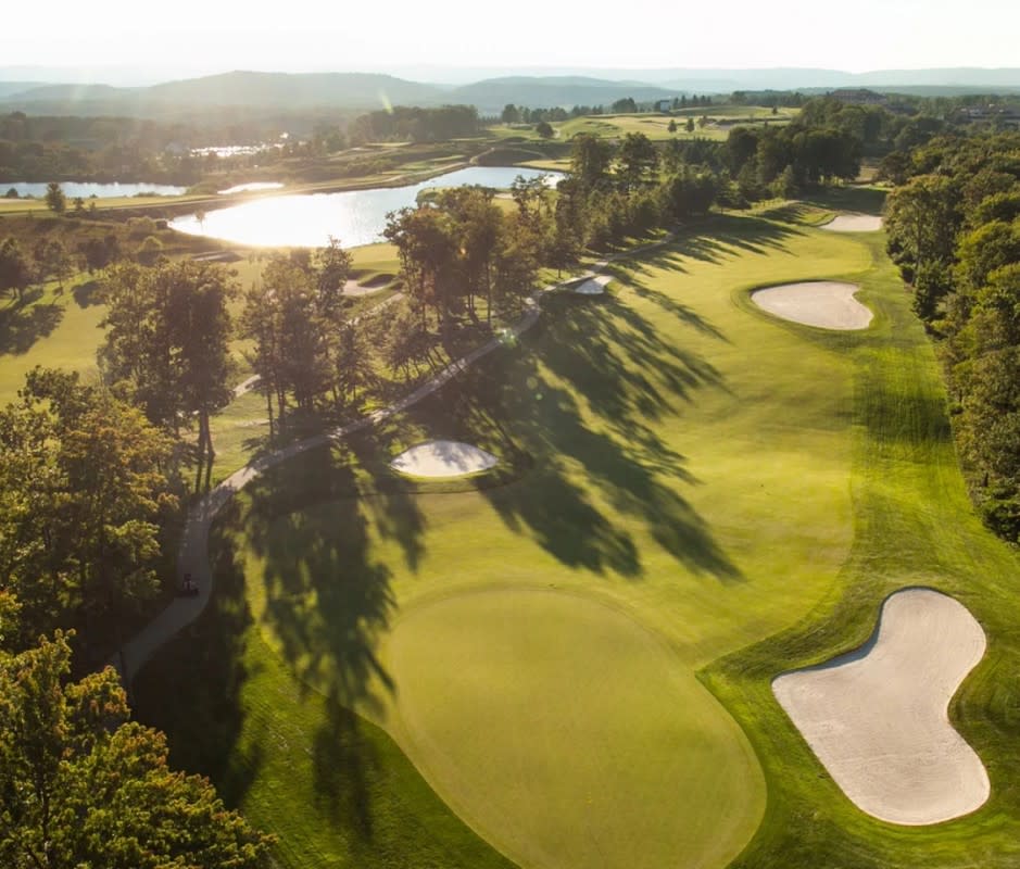 <p>Wrapped by the Allegheny Mountains, another Pete Dye treasure beckons players to the Laurel Highlands of southwest Pennsylvania. Like any land touched by the <em>Bury Me in a Pot Bunker</em> author, this, too, is a championship-caliber test—it hosted the now-defunct 84 Lumber Classic for multiple years. Note to self before you tee off: Golf is meant to be fun, and to ensure said fun at Mystic Rock, be wise and jump one tee box closer. Capeesh?</p>