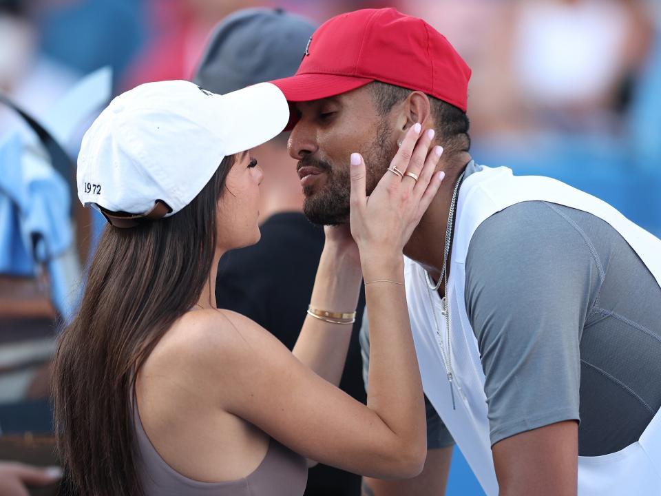 Nick Kyrgios of Australia celebrates with his girlfriend Costeen Hatzi after defeating Yoshihito Nishioka of Japan in their Men's Singles Final match during Day 9 of the Citi Open at Rock Creek Tennis Center on August 7, 2022 in Washington, DC