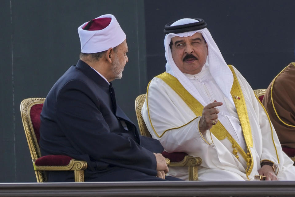 Bahrain's King Hamad bin Isa Al Khalifa, right, talks with Ahmed El-Tayeb, Grand Imam of al-Azhar, as they wait for the arrival of Pope Francis to attend the closing session of the "Bahrain Forum for Dialogue: East and west for Human Coexistence", at the Al-Fida square at the Sakhir Royal palace, Bahrain, Friday, Nov. 4, 2022. Pope Francis is making the November 3-6 visit to participate in a government-sponsored conference on East-West dialogue and to minister to Bahrain's tiny Catholic community, part of his effort to pursue dialogue with the Muslim world. (AP Photo/Alessandra Tarantino)