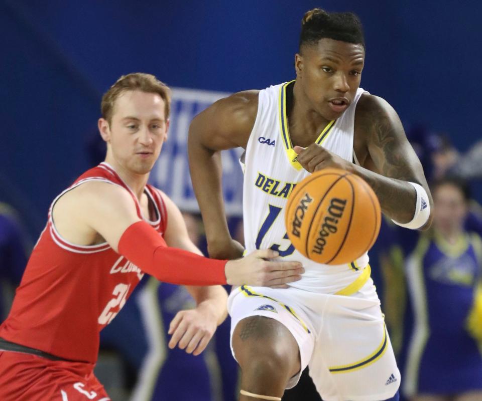 Cornell's Max Watson (left) chases Delaware's Jyare Davis after Davis chipped the ball away from him in the first half at the Bob Carpenter Center, Thursday, Dec. 1, 2022.