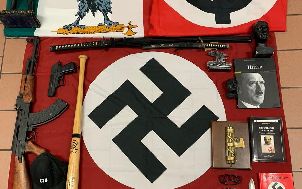 Police seized weapons and a Nazi flag - via REUTERS