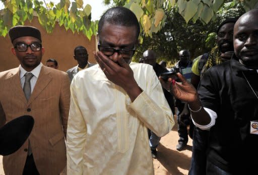 Singer and opposition political activist Youssou N'Dour leaves a polling station after casting his vote in Dakar. Senegal's President Abdoulaye Wade was roundly booed as he cast his ballot Sunday in an election which has sparked deadly protests over his bid for a third term