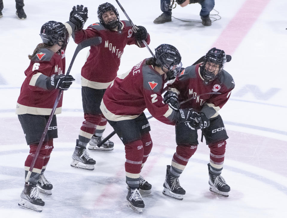 Montreal's Madison Bizal (6) and Kristin O'Neill (43) do-si-do with Mariah Keopple (2) and Gabrielle David (8) following the team's win against New York in a PWHL hockey game Wednesday, April 24, 2024, in Montreal. (Christinne Muschi/The Canadian Press via AP)