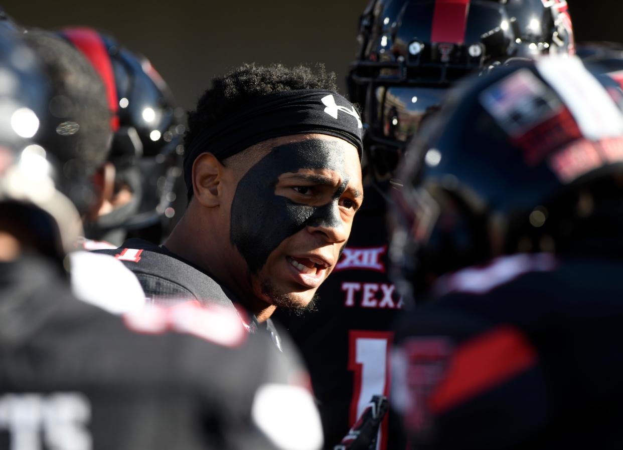 Texas Tech's defensive back Dadrion Taylor-Demerson (1) speaks to the team during warmups before the Big 12 conference football game against Kansas State, Saturday, Oct. 14, 2023, at Jones AT&T Stadium.
