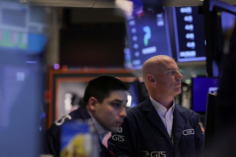 Traders work on the floor of the New York Stock Exchange (NYSE) in New York City