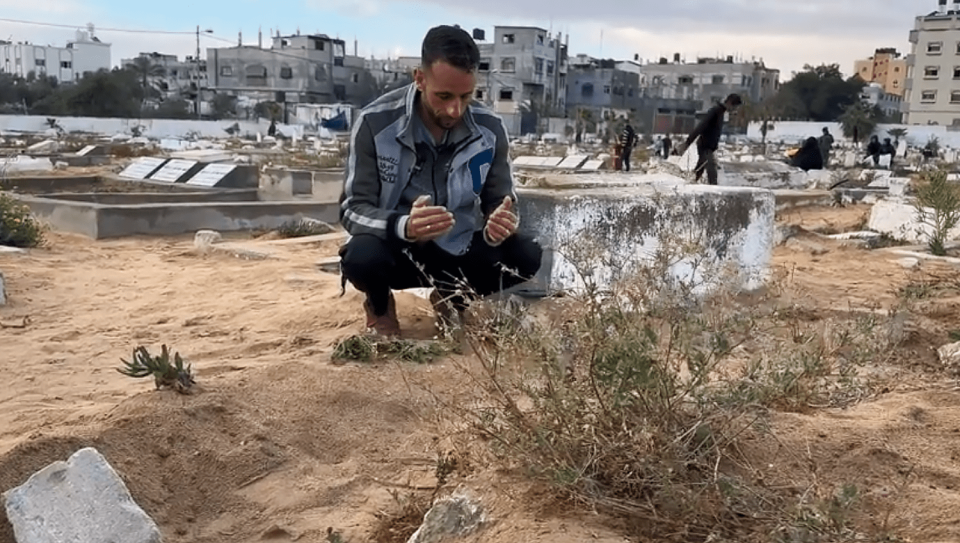 Ahmed al-Jamal prays at the graveside of his 11-year-old son Bassam in Rafah. (NBC News)