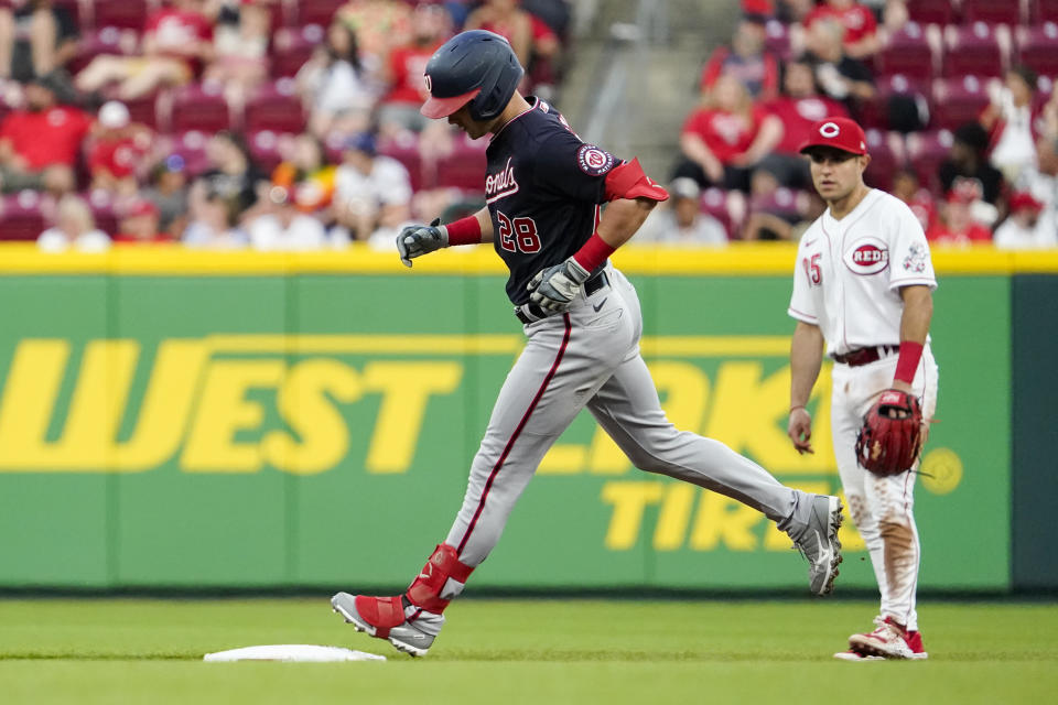 Washington Nationals' Lane Thomas (28) rounds second base after hitting a solo home run during the fifth inning of the team's baseball game against the Cincinnati Reds on Friday, June 3, 2022, in Cincinnati. (AP Photo/Jeff Dean)