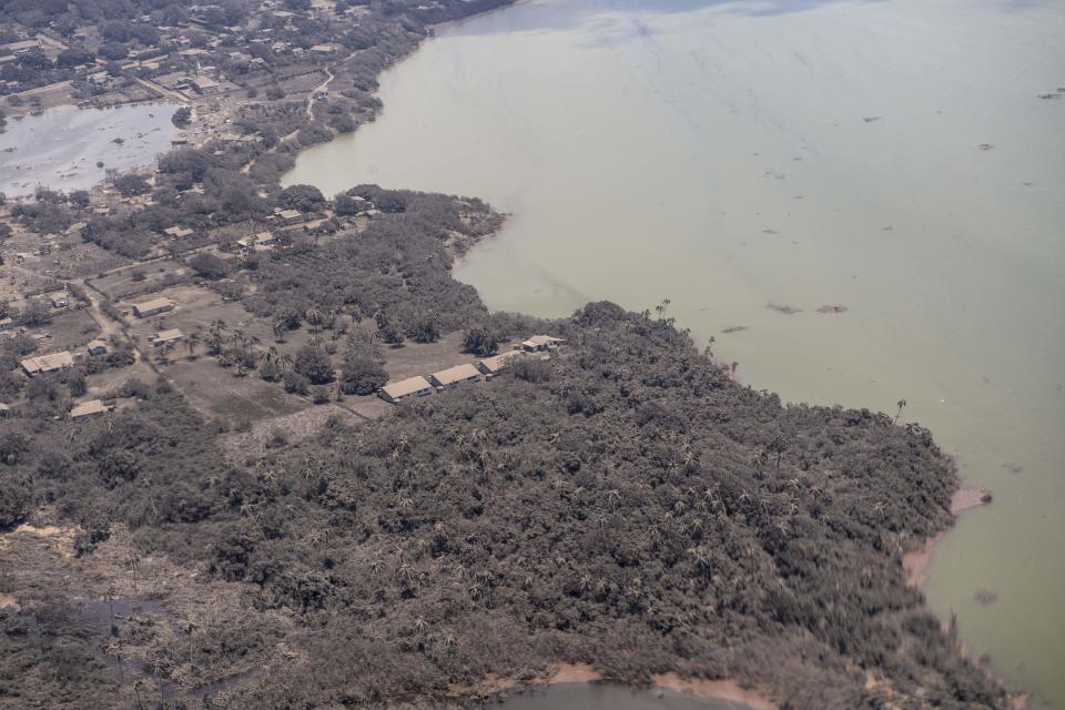 An aerial handout photo provided by the New Zealand Defense Force shows homes covered in ash on January 17, 2022, in Nomuka, Tonga. / Credit: Handout/New Zealand Defense Force/Getty