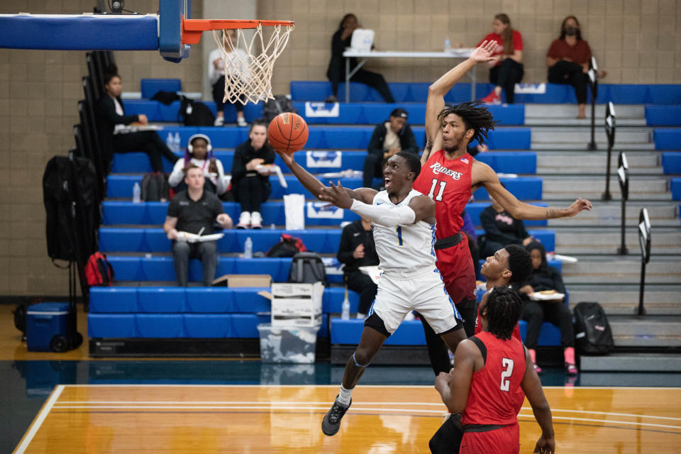 Tallahassee Community College guard DeAngelo Ware (1) reaches for the hoop to put up a shot during a game between TCC and Northwest Florida State College at TCC Thursday, March 25, 2021.