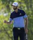 Dustin Johnson reacts after sinking a putt on the 14th green during the third round of the PGA Championship golf tournament, Saturday, May 18, 2019, at Bethpage Black in Farmingdale, N.Y. (AP Photo/Seth Wenig)