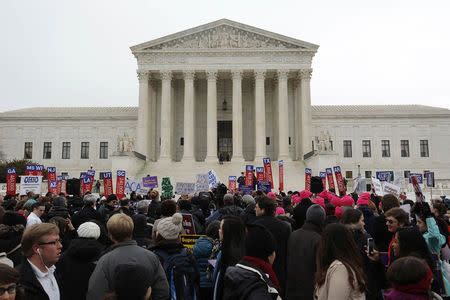 Demonstrators in favor of Obamacare gather at the Supreme Court building in Washington March 4, 2015. REUTERS/Jonathan Ernst